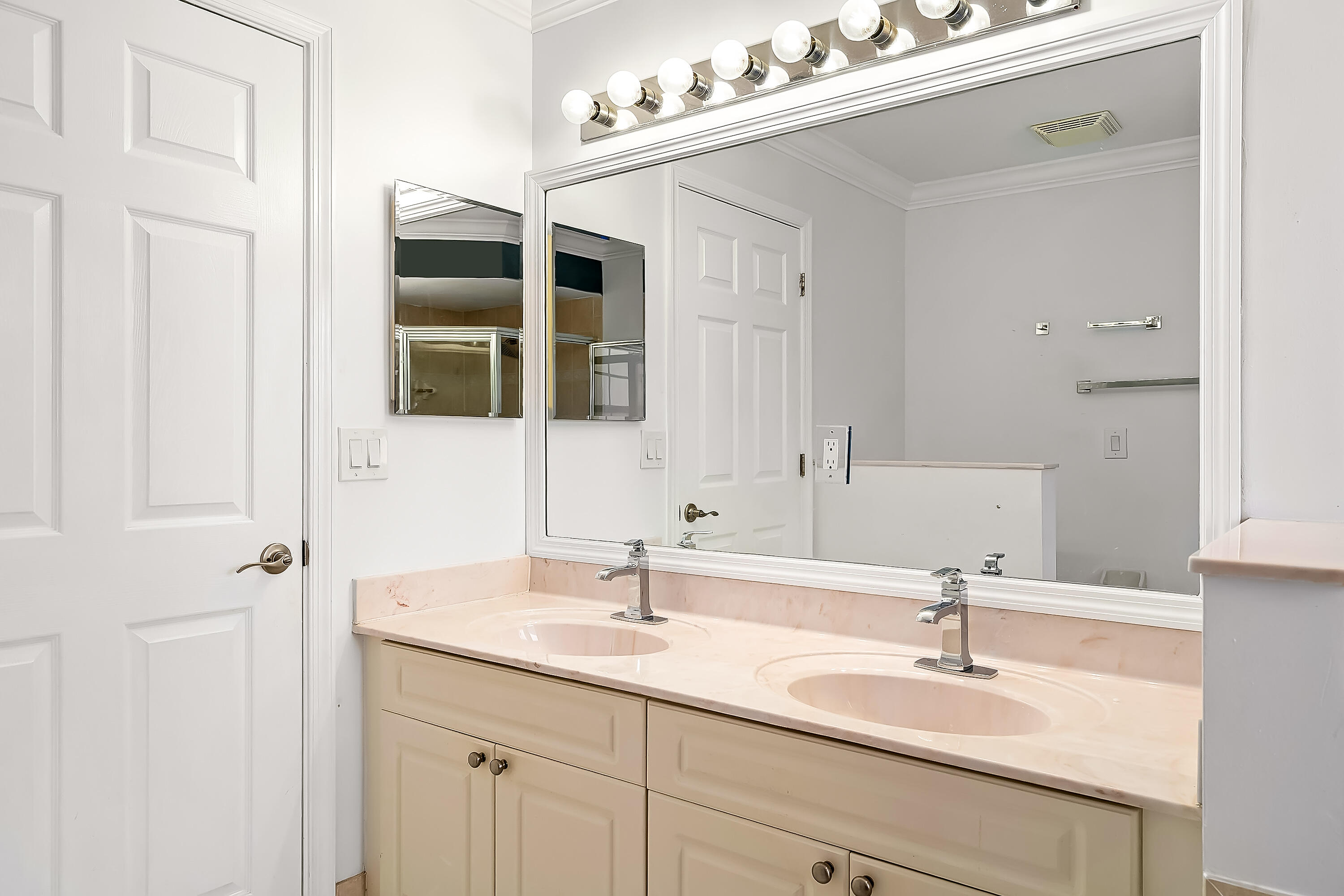 2962 Southwest Coastal Terrace Port St. Lucie, FL 34953 - Photo 52 of 59 a bathroom with a sink vanity and mirror