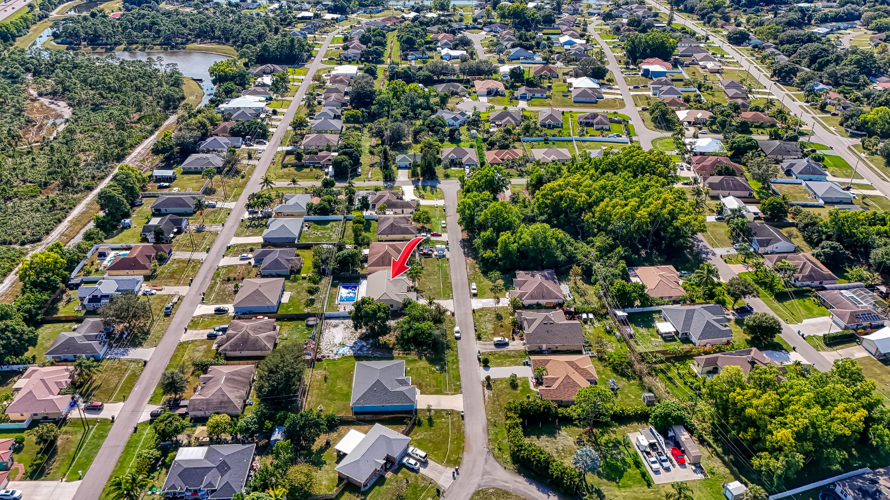 2962 Southwest Coastal Terrace Port St. Lucie, FL 34953 - Photo 57 of 59 an aerial view of residential houses with outdoor space and street view
