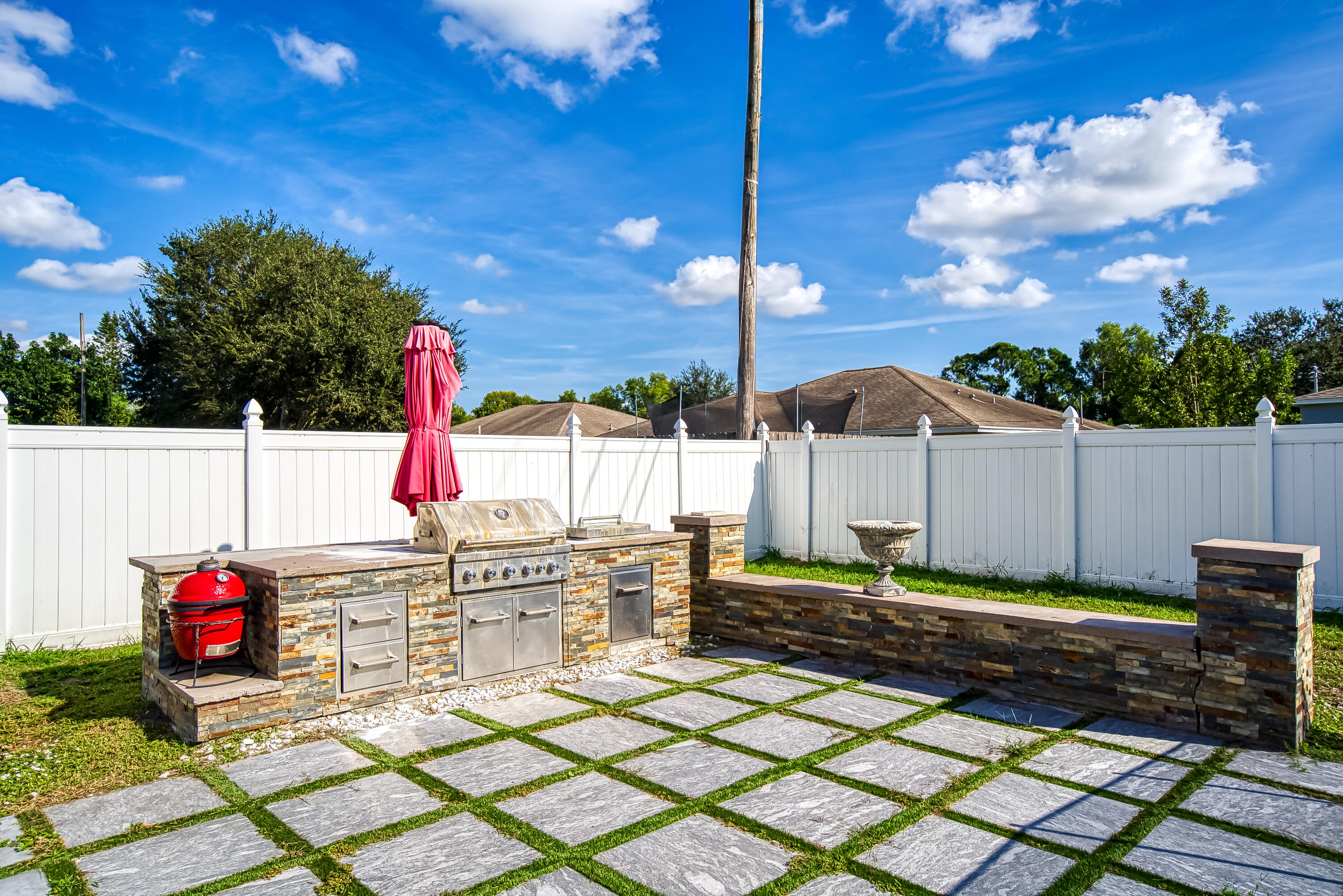 2962 Southwest Coastal Terrace Port St. Lucie, FL 34953 - Photo 10 of 59 a view of an entryway with a fire pit