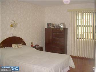 838 Hendrix Street Philadelphia, PA 19116 - Photo 6 of 12 a bedroom with a bed and a window