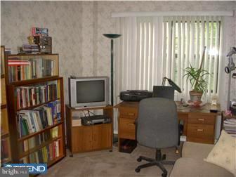 838 Hendrix Street Philadelphia, PA 19116 - Photo 10 of 12 a view of a workspace with furniture and a window