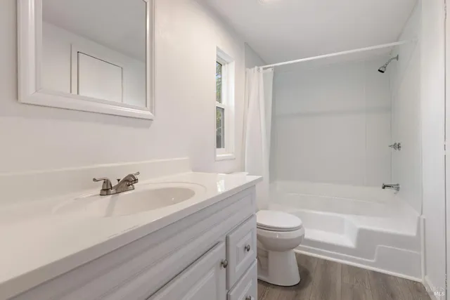 a bathroom with a sink a toilet and a bathtub