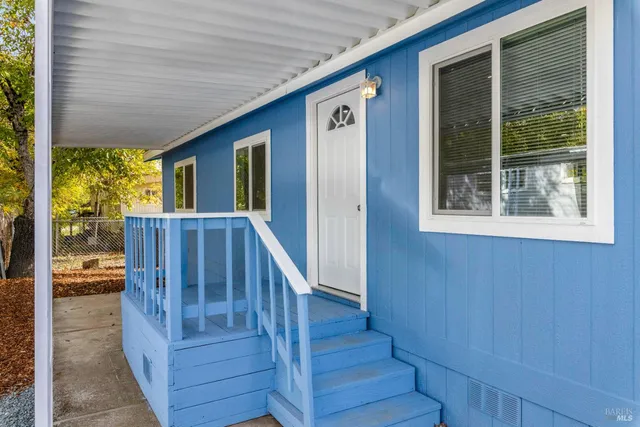 a view of a porch with wooden floor and outdoor space