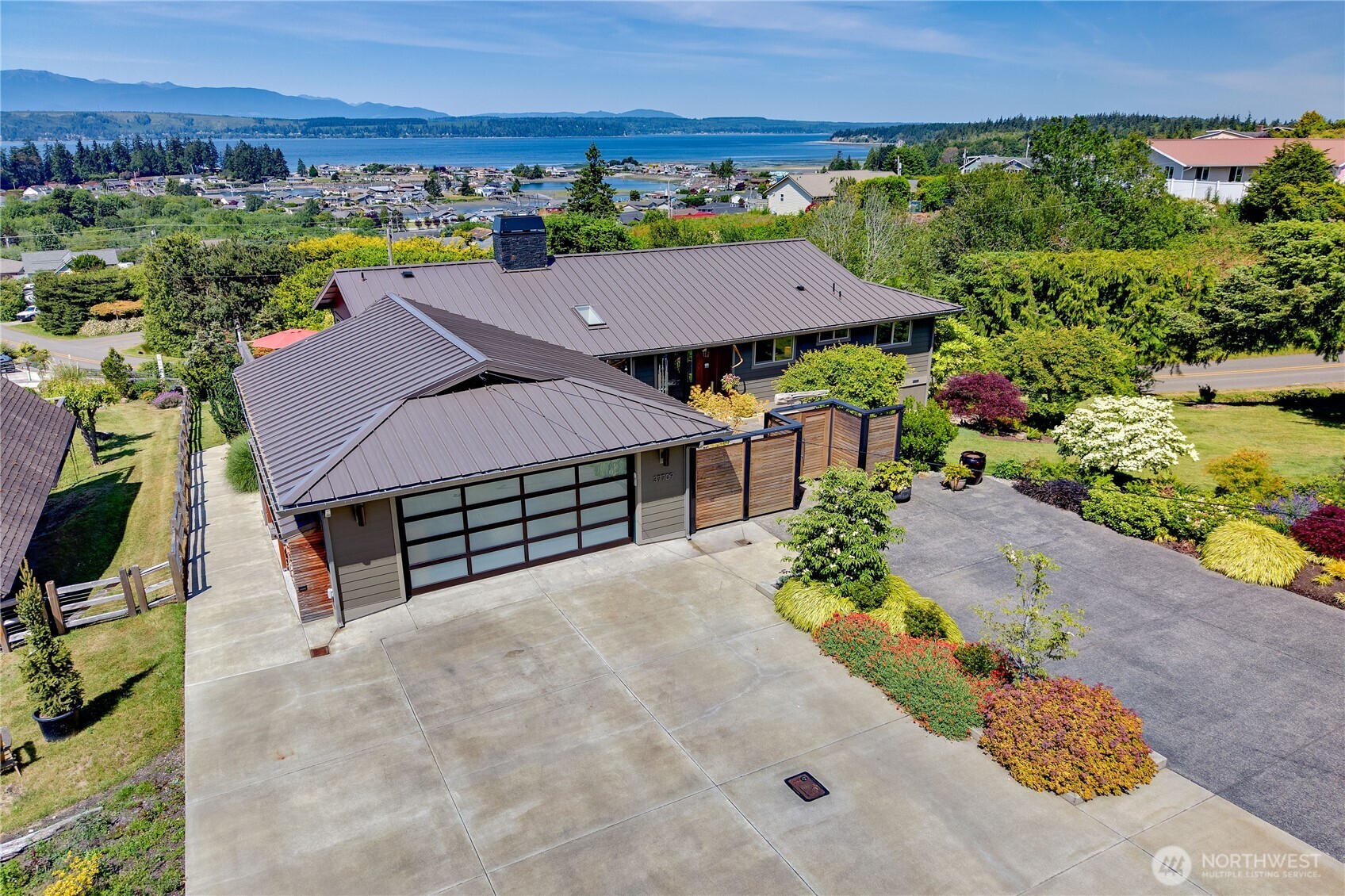 37709 Olympic View Road Northeast Hansville, WA 98340 - Photo 2 of 40 an aerial view of a house with a yard