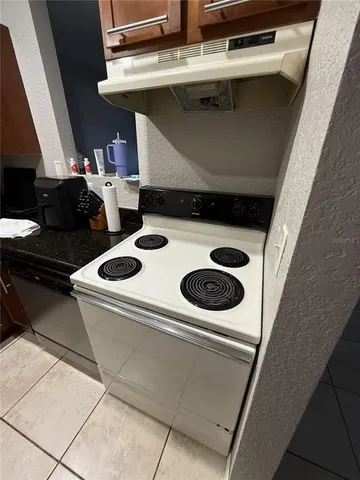 a view of hallway with a couch and a window