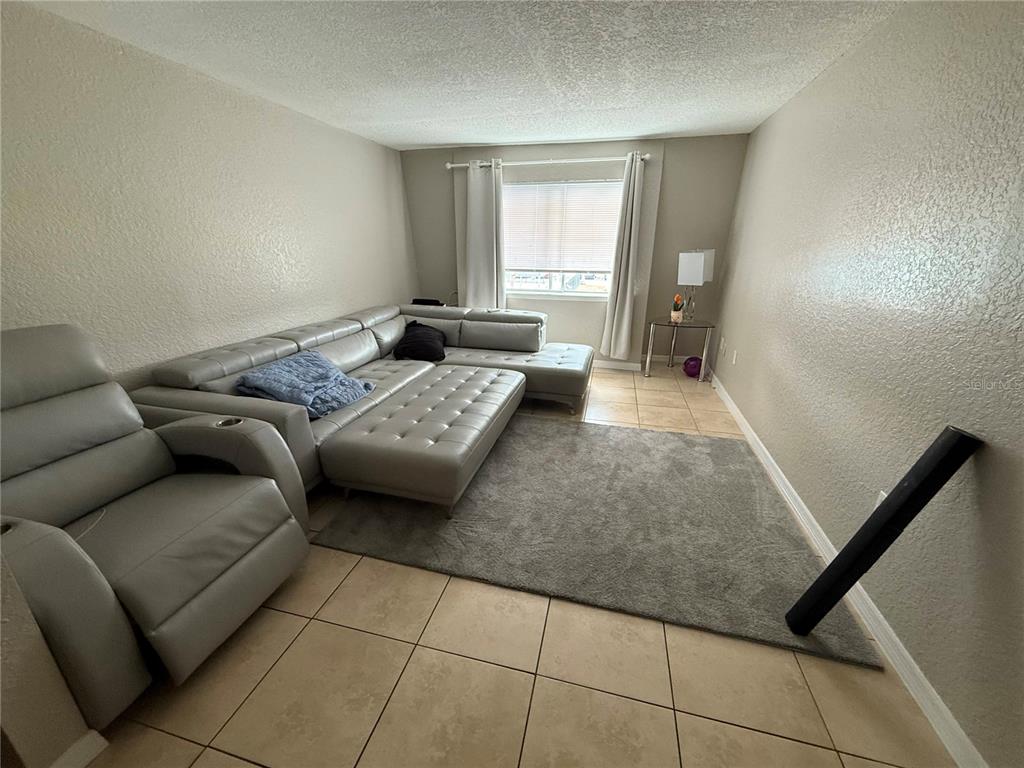 1928 South Conway Road, Unit 35 Orlando, FL 32812 - Photo 2 of 16 a living room with furniture and a window