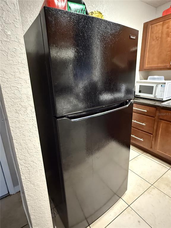 1928 South Conway Road, Unit 35 Orlando, FL 32812 - Photo 10 of 16 a close view of sink and microwave