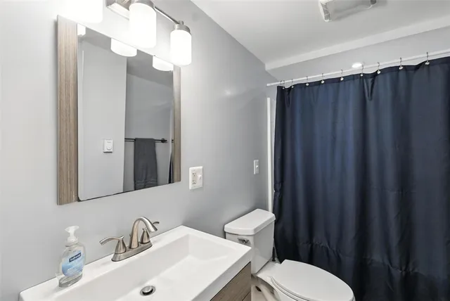 a bedroom with furniture and a chandelier