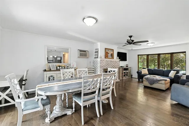 a view of a dining room with furniture window and wooden floor