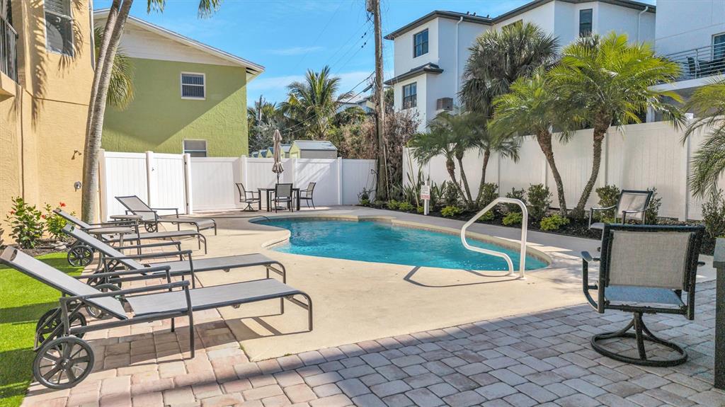 436 Canal Road, Unit A Sarasota, FL 34242 - Photo 79 of 94 a view of a swimming pool with a patio and a yard