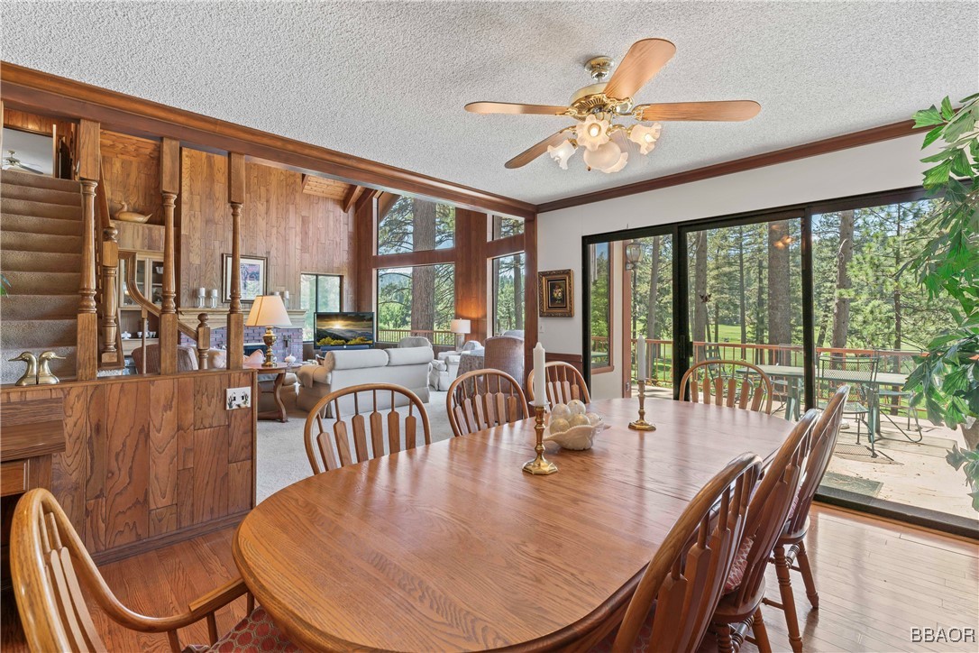 524 Golf Course Road Lake Arrowhead, CA 92352 - Photo 13 of 50 a dining room with furniture a chandelier and wooden floor
