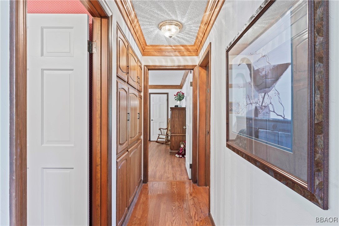 524 Golf Course Road Lake Arrowhead, CA 92352 - Photo 19 of 50 a view of a hallway with wooden floor and stairs