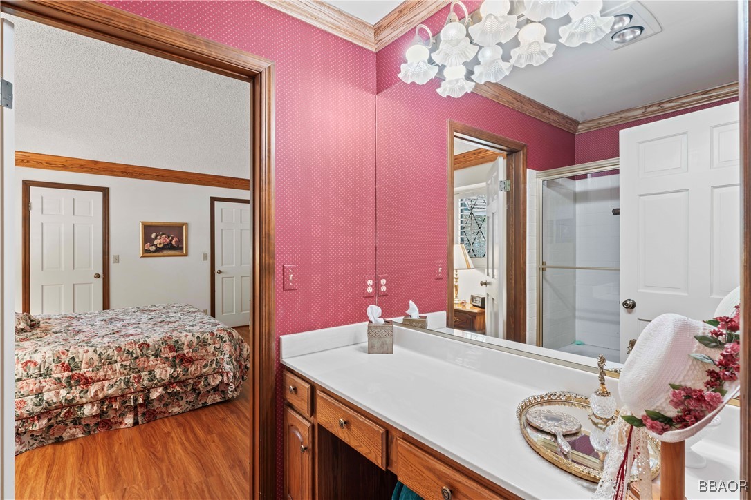 524 Golf Course Road Lake Arrowhead, CA 92352 - Photo 21 of 50 a bedroom with a bed dresser and a large mirror