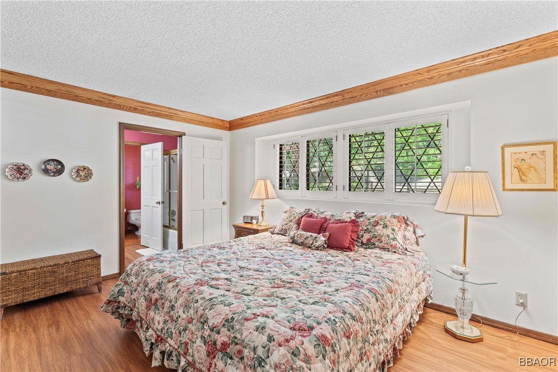 524 Golf Course Road Lake Arrowhead, CA 92352 - Photo 23 of 50 a bedroom with a bed and a window