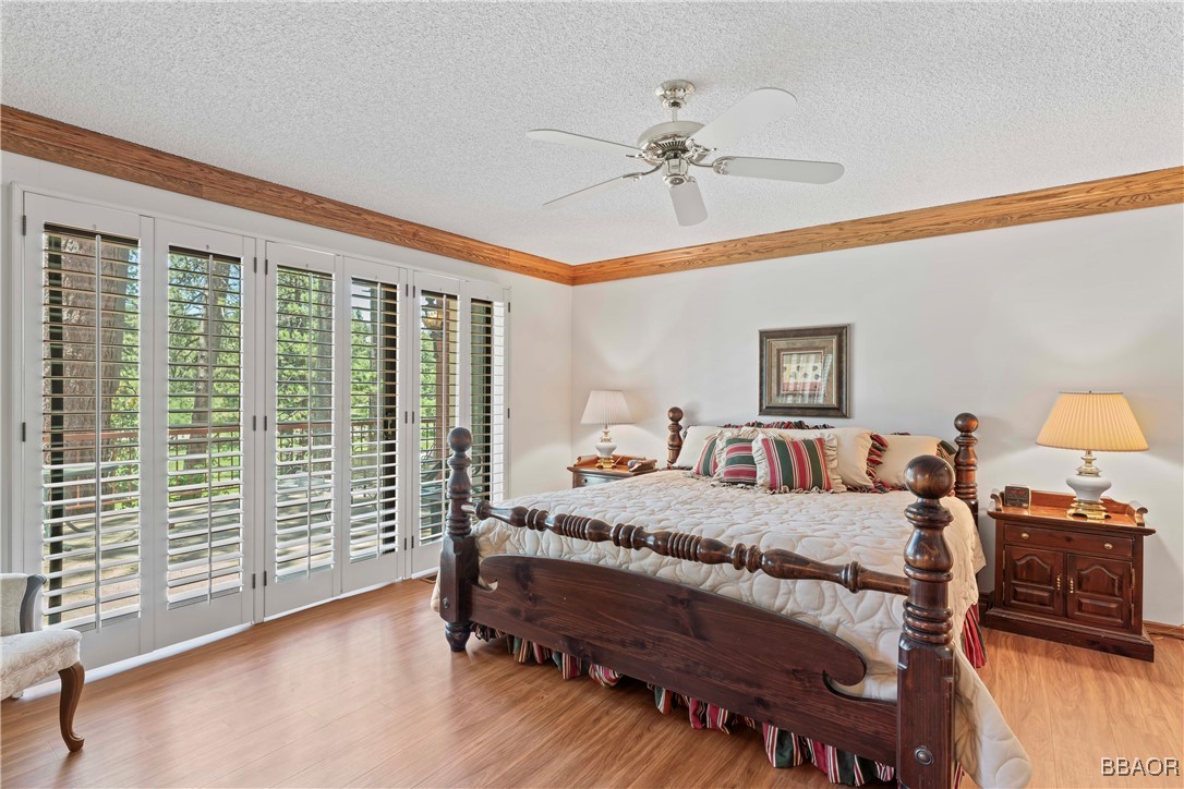 524 Golf Course Road Lake Arrowhead, CA 92352 - Photo 25 of 50 a bedroom with a bed a bookshelf and a window