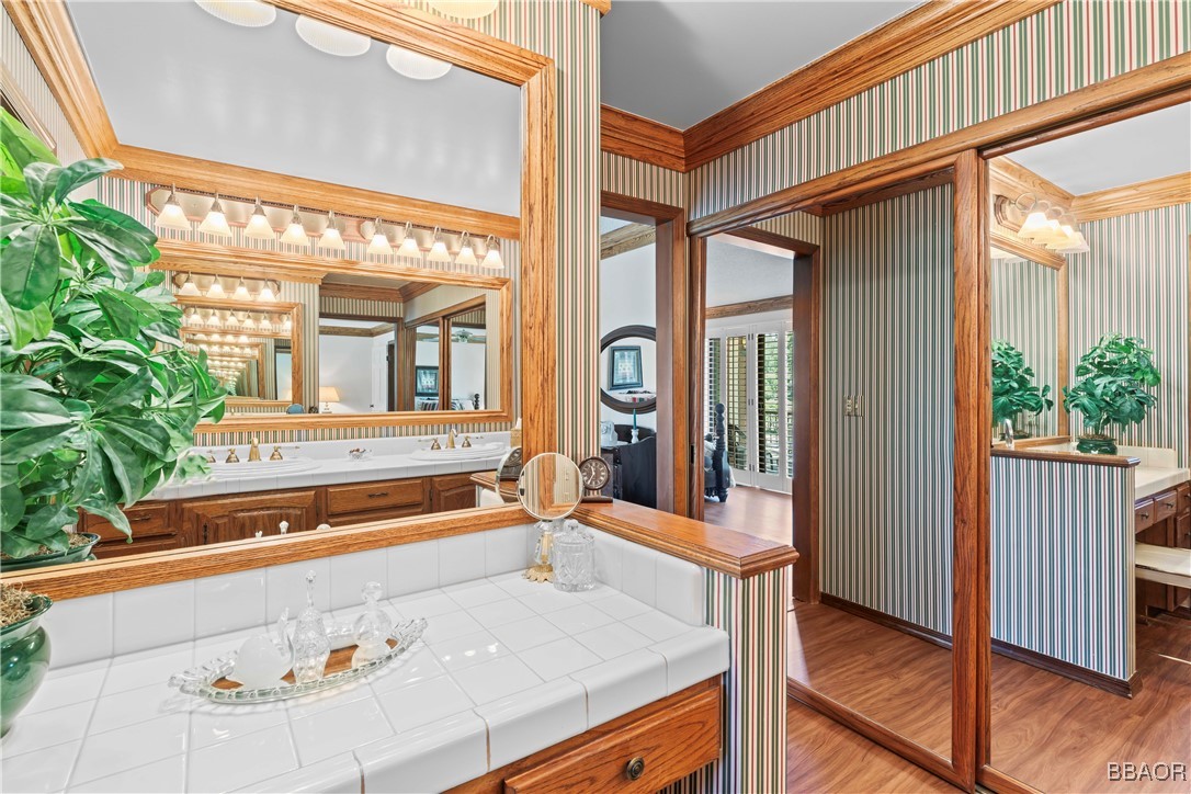 524 Golf Course Road Lake Arrowhead, CA 92352 - Photo 29 of 50 a bathroom with a sink and a mirror