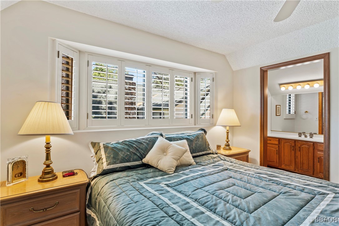 524 Golf Course Road Lake Arrowhead, CA 92352 - Photo 36 of 50 a bed room with a bed and a lamp