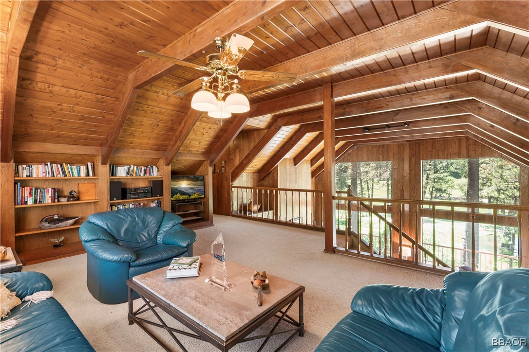 524 Golf Course Road Lake Arrowhead, CA 92352 - Photo 37 of 50 a living room with furniture a chandelier and a rug
