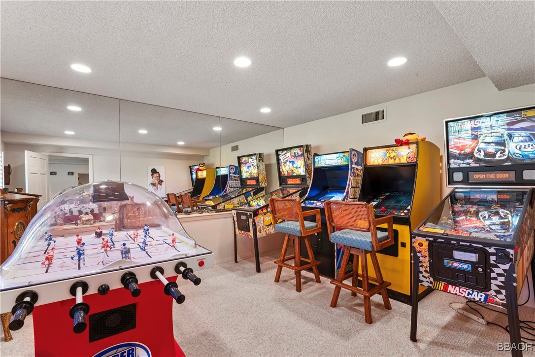 524 Golf Course Road Lake Arrowhead, CA 92352 - Photo 46 of 50 a living room with lots of furniture and a flat screen tv