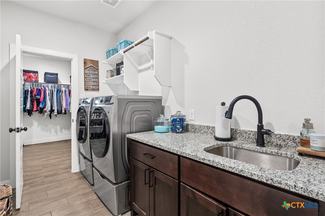 979 Inka Road Salado, TX 76571 - Photo 27 of 47 Laundry Room access from both Primary Closet & Hallway