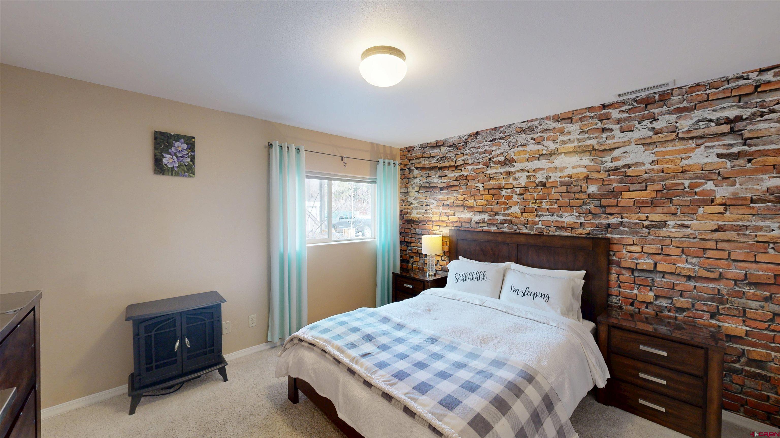 841 Woodbridge Way Durango, CO 81301 - Photo 12 of 27 a bedroom with a bed and a window