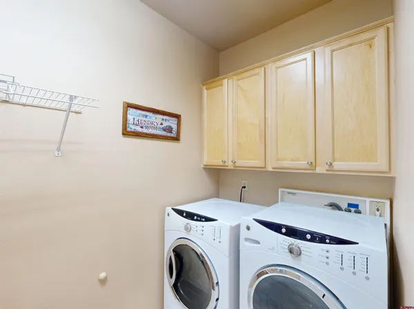 a view of storage and utility room with washer and dryer