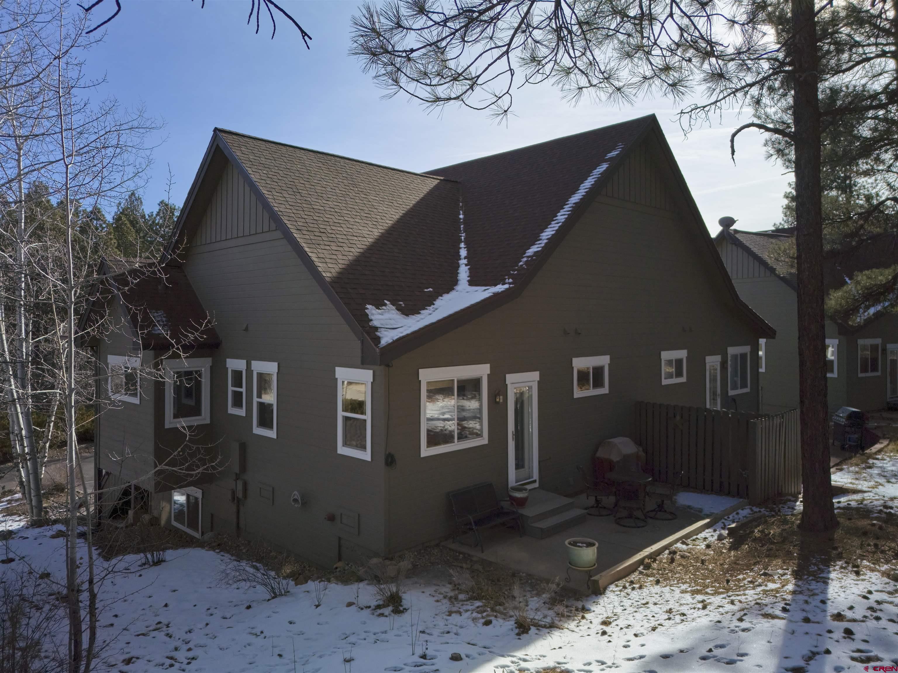 841 Woodbridge Way Durango, CO 81301 - Photo 18 of 27 a front view of a house with garden