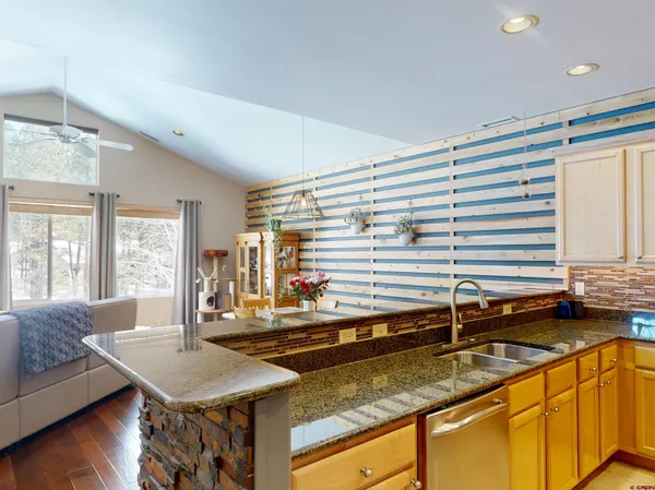 a kitchen with a sink and a large window