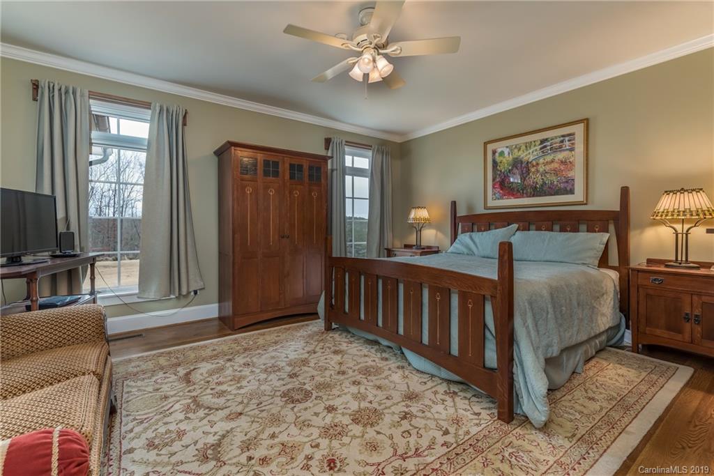 1723 Clark Road Rutherfordton, NC 28139 - Photo 15 of 37 a spacious bedroom with a bed a couch and dresser