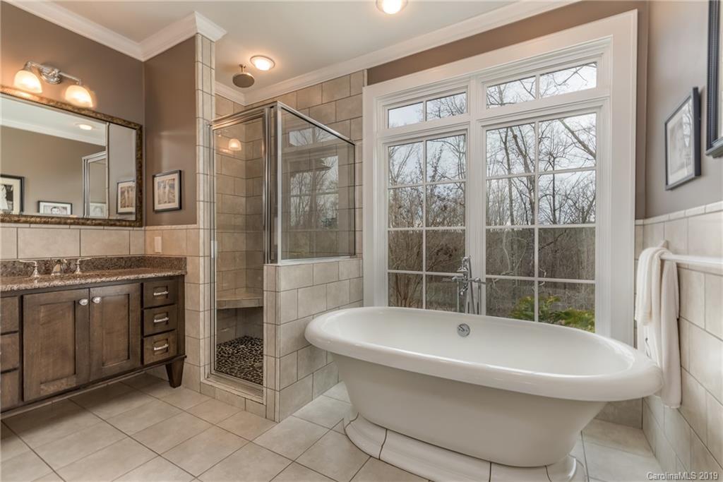 1723 Clark Road Rutherfordton, NC 28139 - Photo 17 of 37 a bathroom with a granite countertop sink toilet and shower