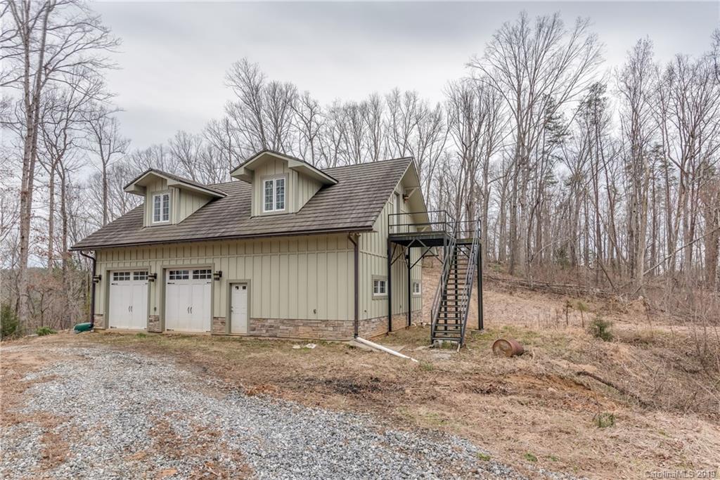 1723 Clark Road Rutherfordton, NC 28139 - Photo 35 of 37 a front view of a house with a yard and garage
