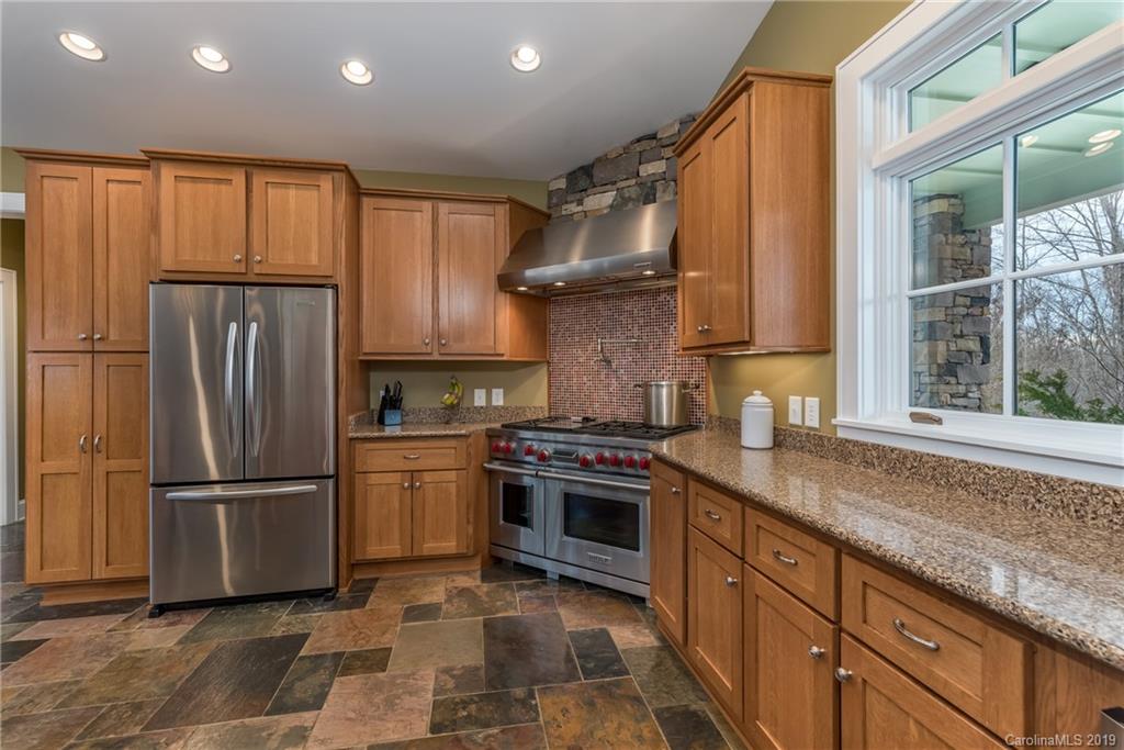 1723 Clark Road Rutherfordton, NC 28139 - Photo 10 of 37 a kitchen with stainless steel appliances granite countertop a refrigerator stove and sink