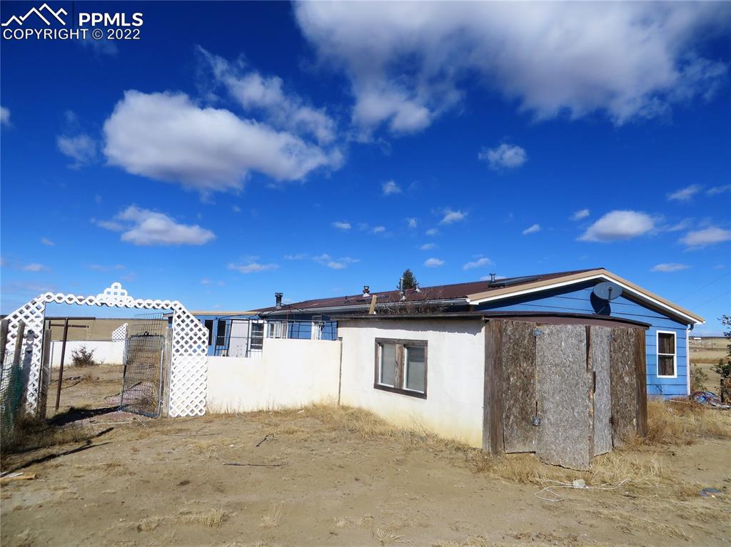 33895 Bellemont Road Yoder, CO 80864 - Photo 2 of 10 a view of a house with a patio