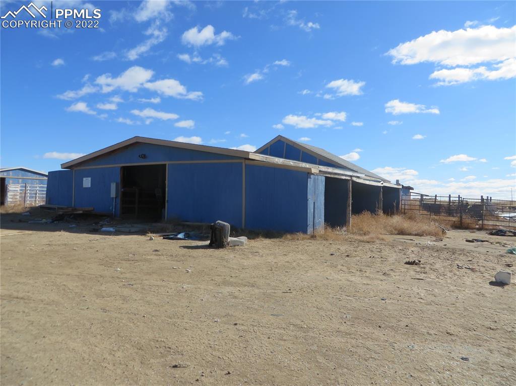 33895 Bellemont Road Yoder, CO 80864 - Photo 7 of 10 a view of a house with a yard