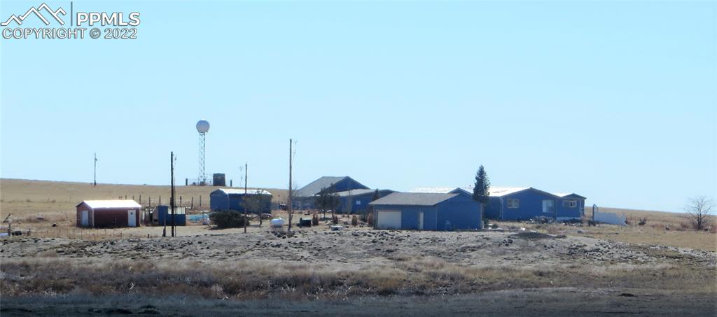 33895 Bellemont Road Yoder, CO 80864 - Photo 10 of 10 a view of a dry yard with wooden fence