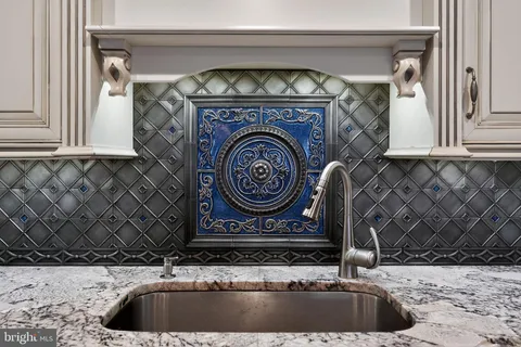 a closeup of a sink and a stove