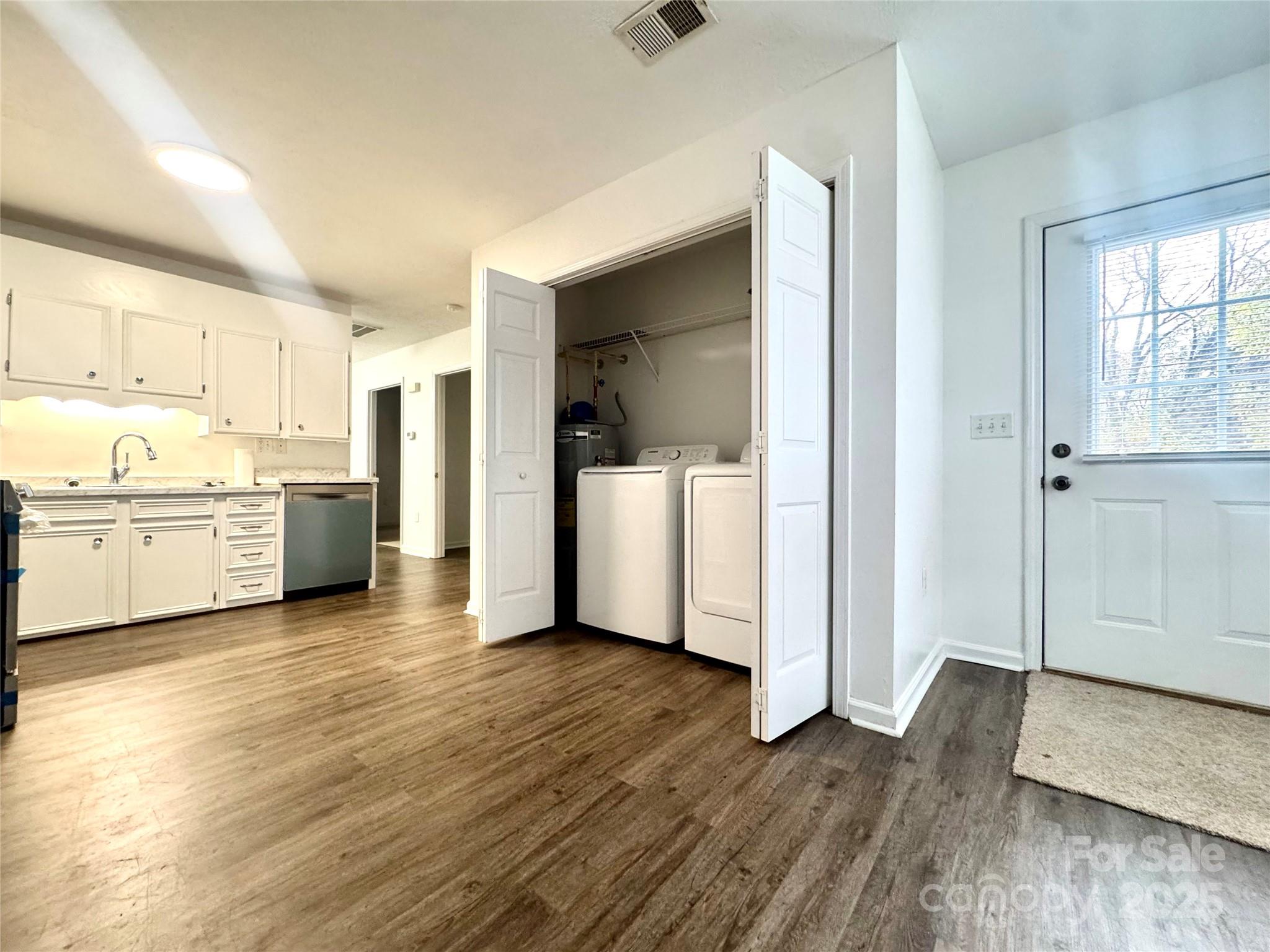 117 24th Street Northwest Hickory, NC 28601 - Photo 12 of 22 a view of a kitchen with wooden floor and a sink