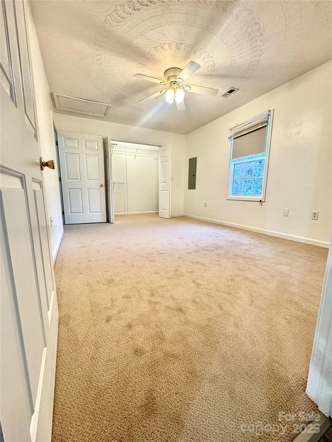 117 24th Street Northwest Hickory, NC 28601 - Photo 14 of 22 a view of an empty room with wooden floor and a window