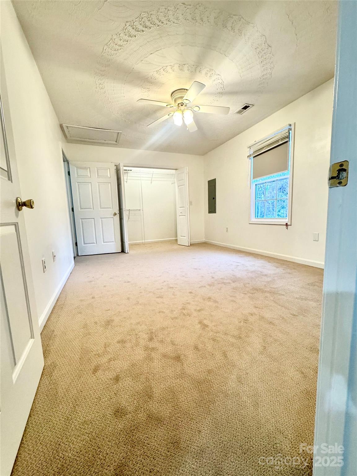 117 24th Street Northwest Hickory, NC 28601 - Photo 15 of 22 en empty room with windows and ceiling fan