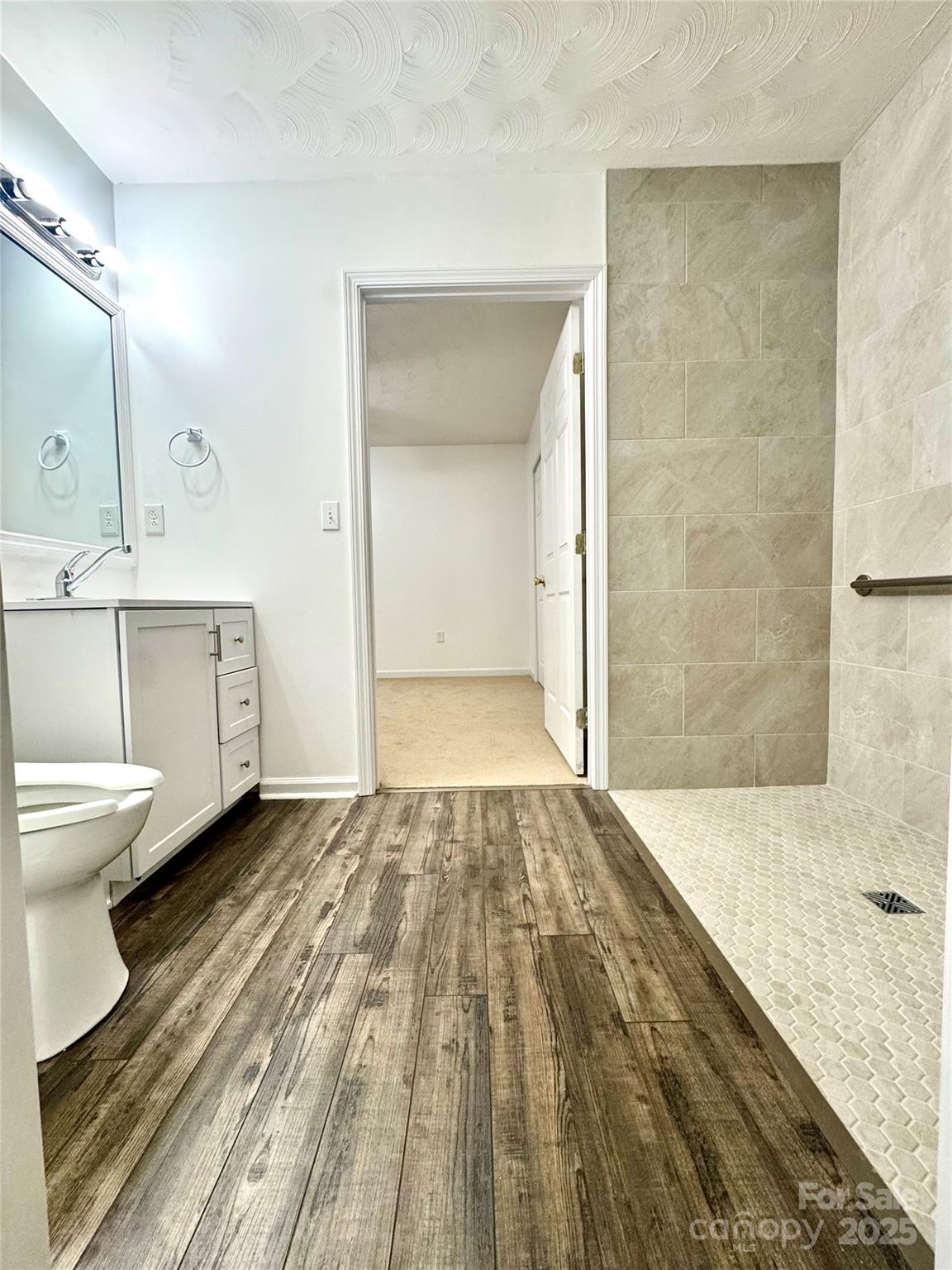 117 24th Street Northwest Hickory, NC 28601 - Photo 19 of 22 a bathroom with a sink and a mirror