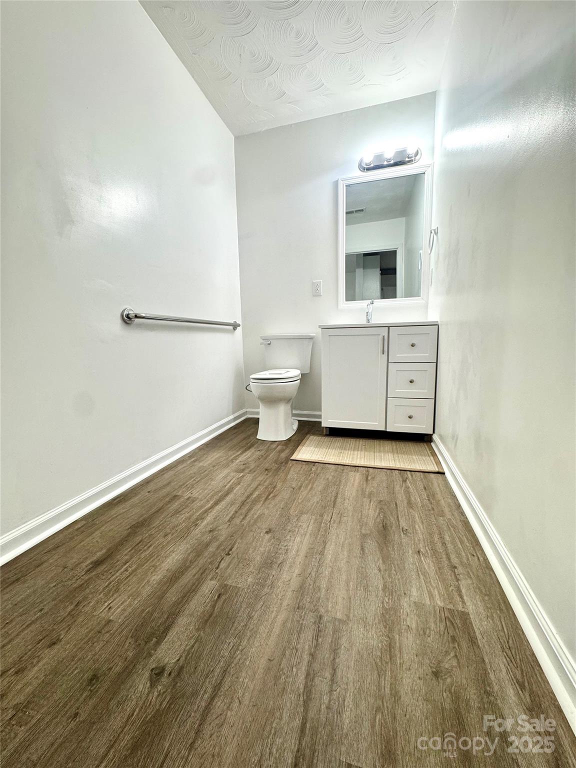 117 24th Street Northwest Hickory, NC 28601 - Photo 22 of 22 a bathroom with a sink and a mirror
