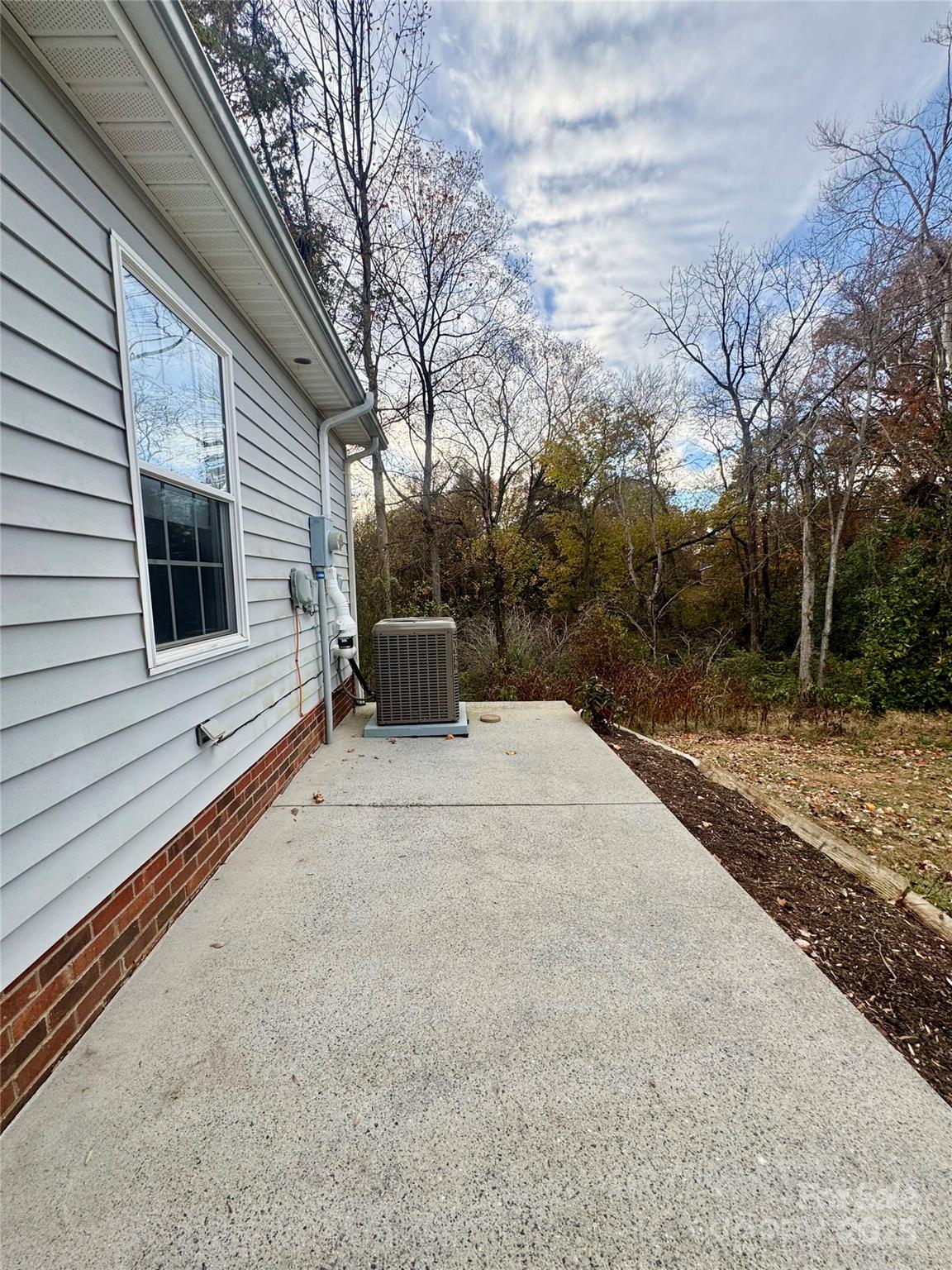 117 24th Street Northwest Hickory, NC 28601 - Photo 4 of 22 a backyard of a house with table and sofas