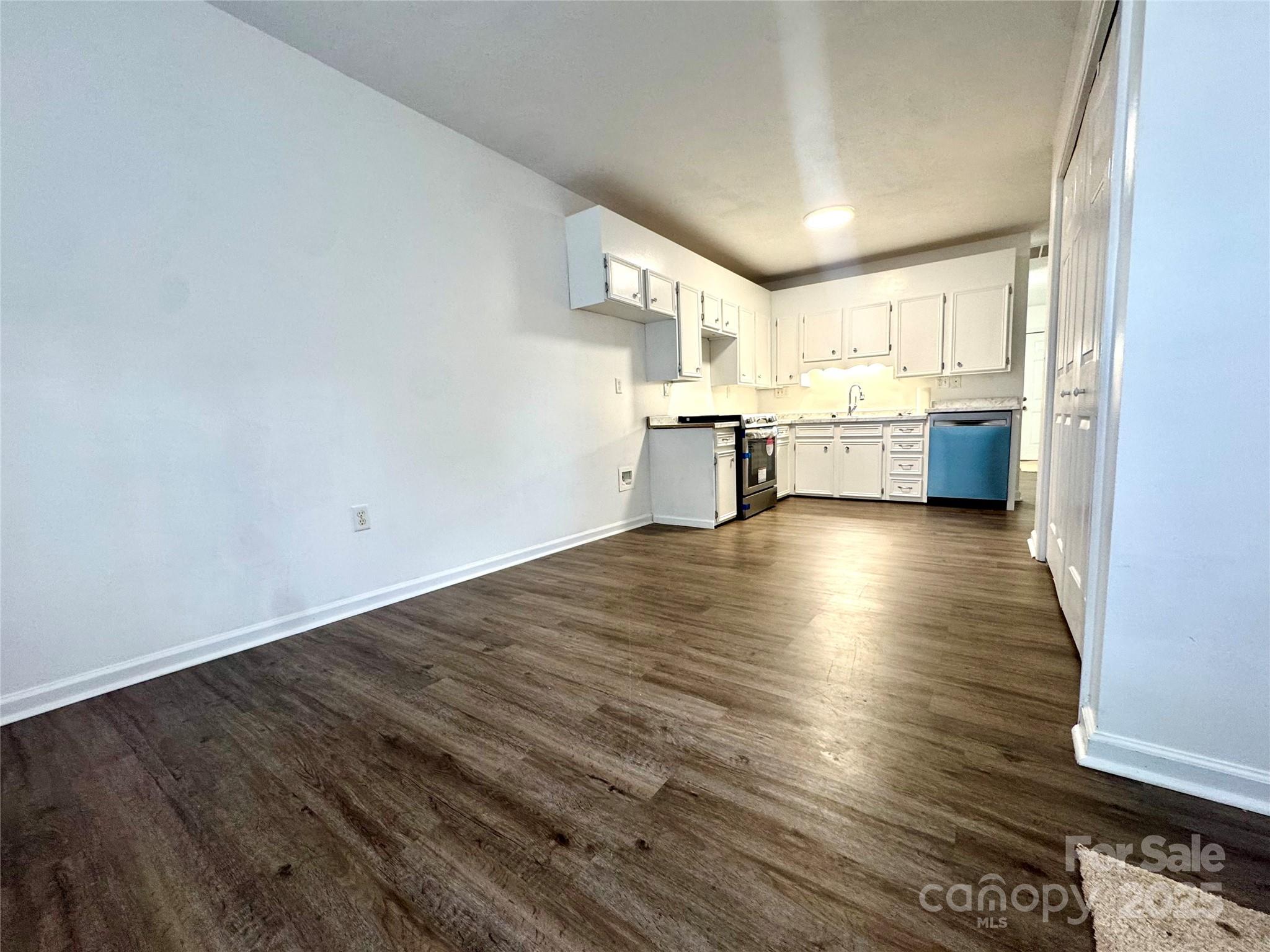 117 24th Street Northwest Hickory, NC 28601 - Photo 10 of 22 a view of a kitchen with wooden floor