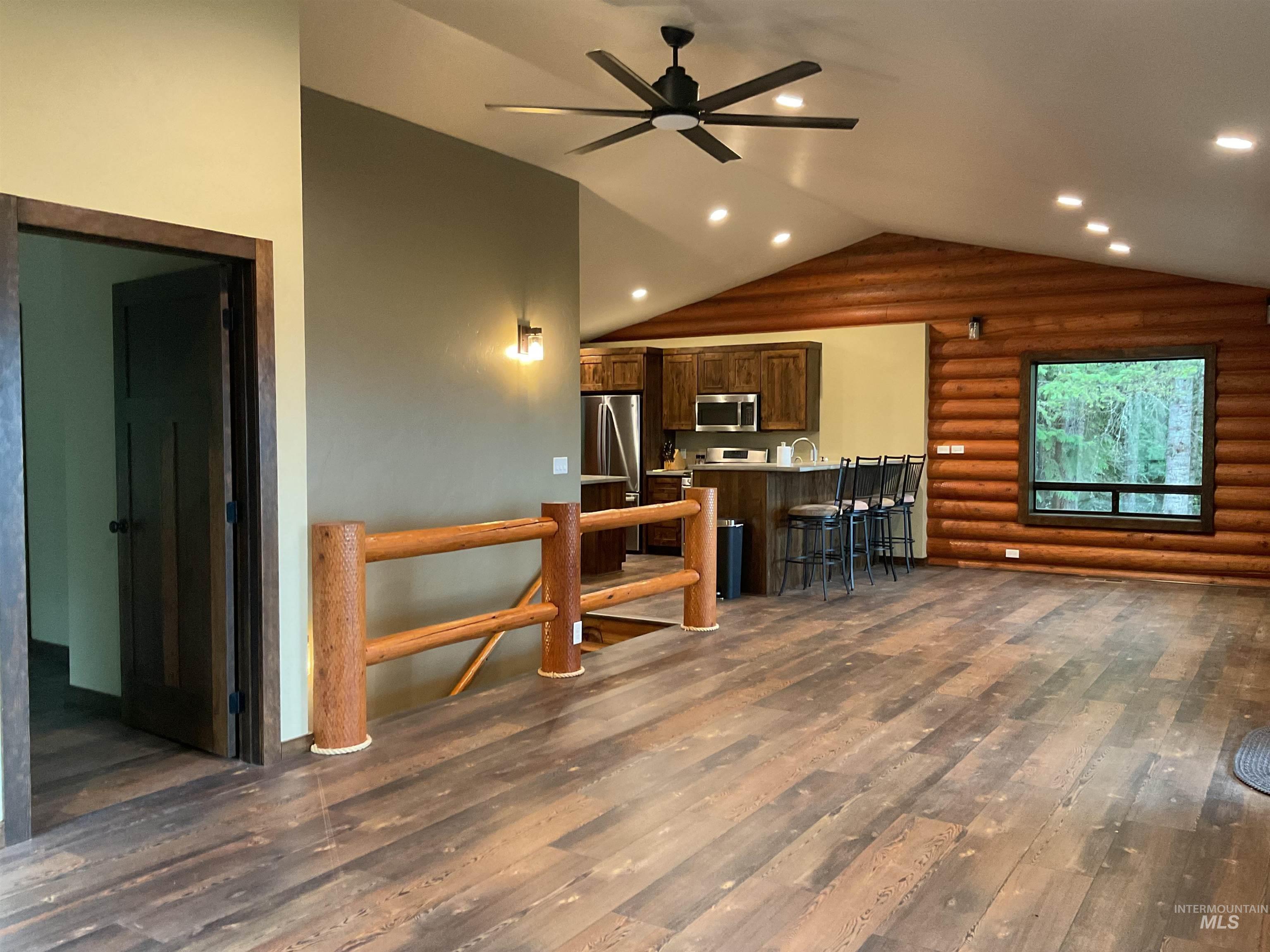 6125 Freeman Creek Road Lenore, ID 83541 - Photo 13 of 44 Open-concept living area with vaulted ceilings, recessed lighting, and wood-finish flooring