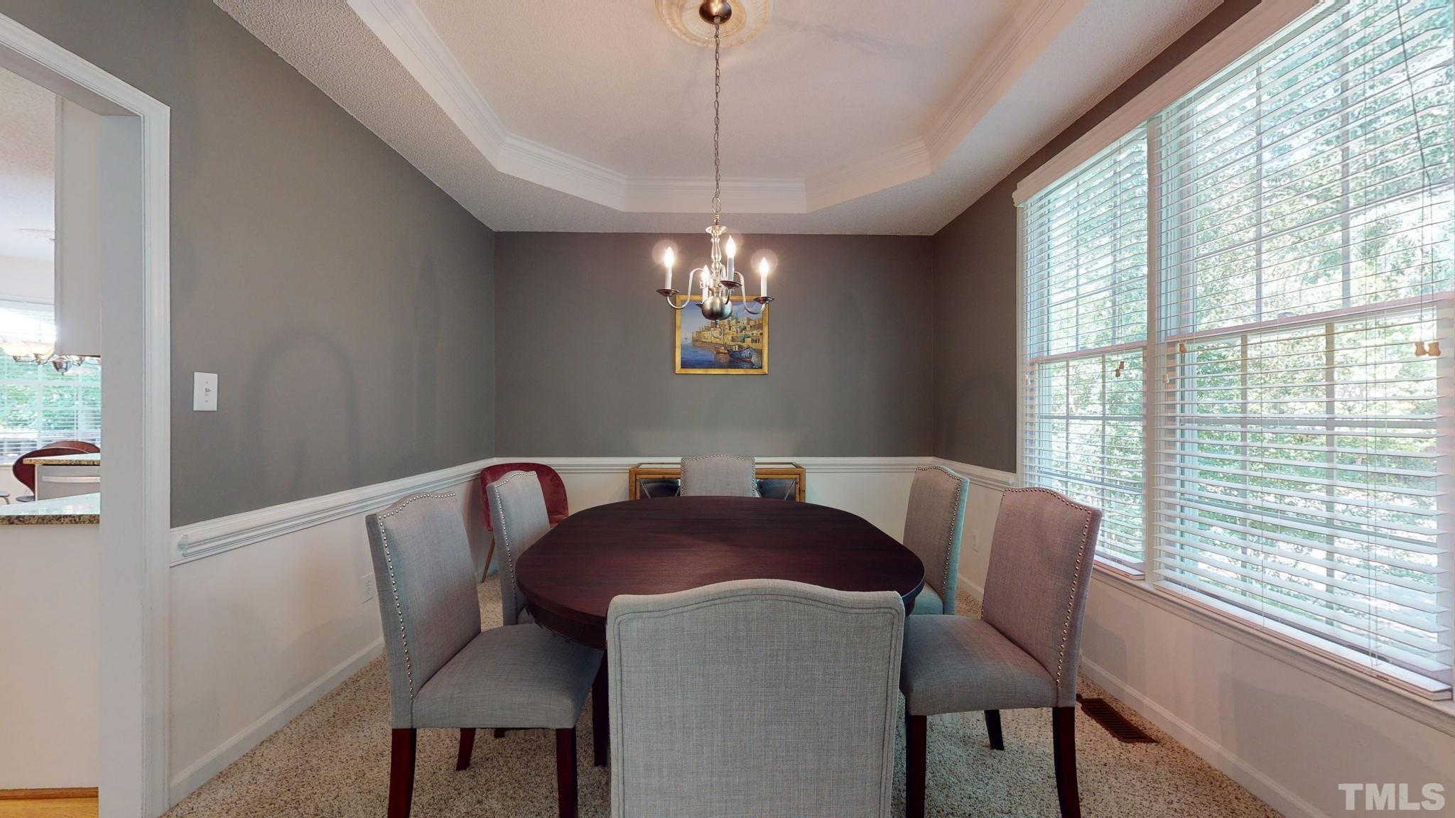 7900 Broad Street Raleigh, NC 27613 - Photo 12 of 53 a view of a dining room with furniture window and outside view