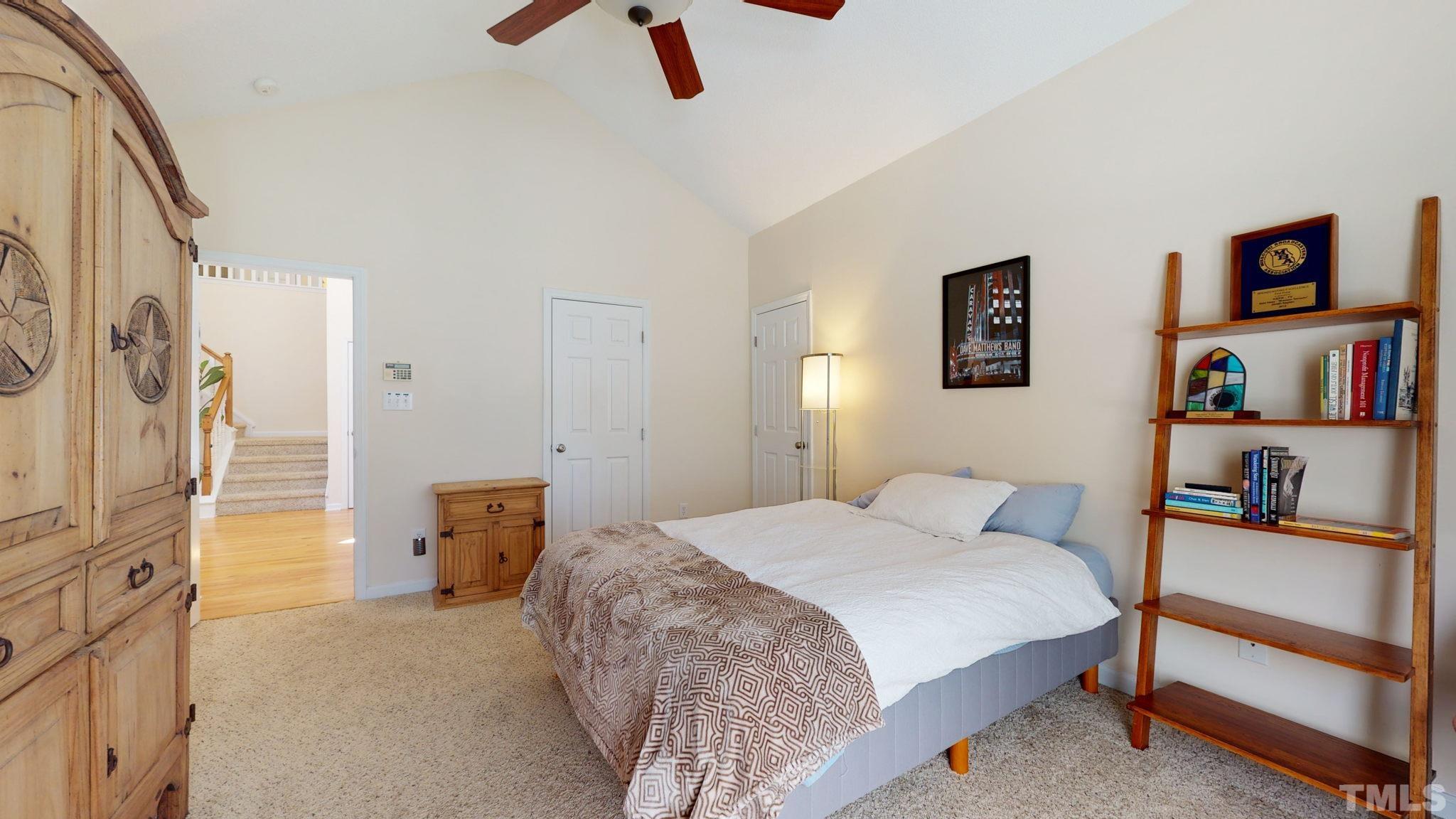 7900 Broad Street Raleigh, NC 27613 - Photo 17 of 53 a bedroom with a bed and a lamp on the dresser