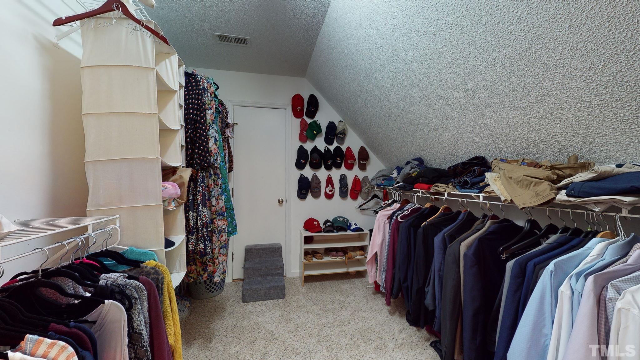 7900 Broad Street Raleigh, NC 27613 - Photo 31 of 53 a view of walk in closet with clothes and shoes
