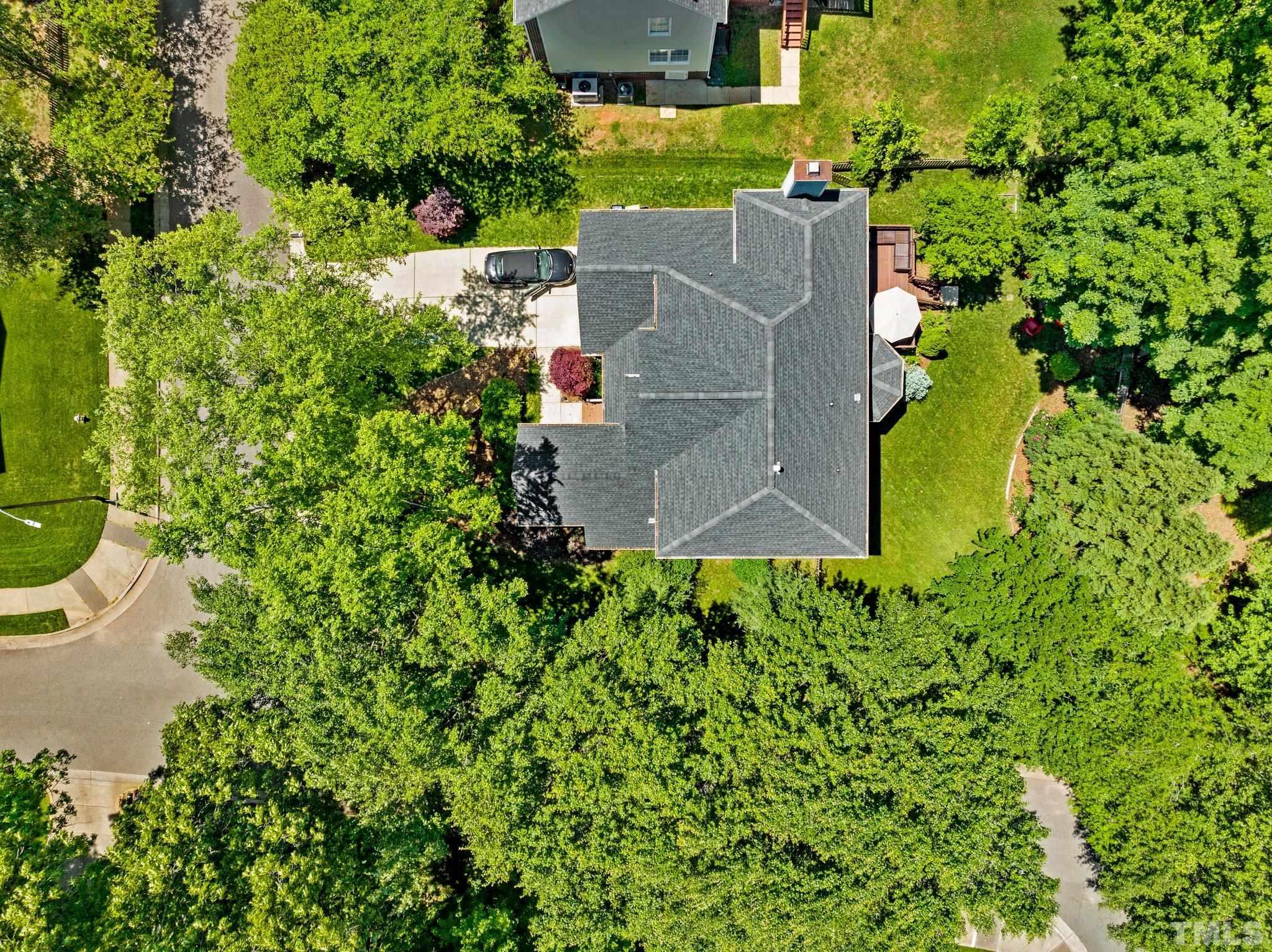 7900 Broad Street Raleigh, NC 27613 - Photo 44 of 53 an aerial view of a house with a yard and swimming pool