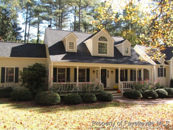 165 Cliff Road Southern Pines, NC 28387 - Photo 1 of 11 a front view of a house with a yard
