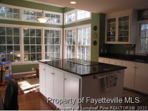 165 Cliff Road Southern Pines, NC 28387 - Photo 3 of 11 a kitchen with granite countertop a stove and a sink